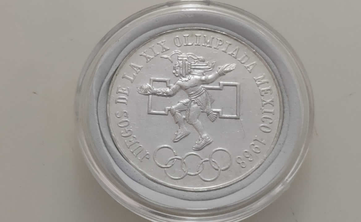 Moneda Olímpica de aros bajos. El error que aparece en 30 millones de piezas de plata