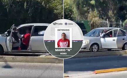 VIDEO Mujer se cuelga de la puerta para impedir que ladrón robara sus pertenencias en Puebla