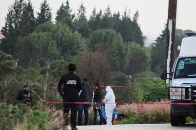 Hallan cadáver dentro de una maleta en la intersección del Periférico y la México-Puebla