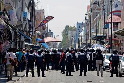 Conflicto entre grupos criminales, la causa de la gresca entre ambulantes en Puebla, aseguró Barbosa